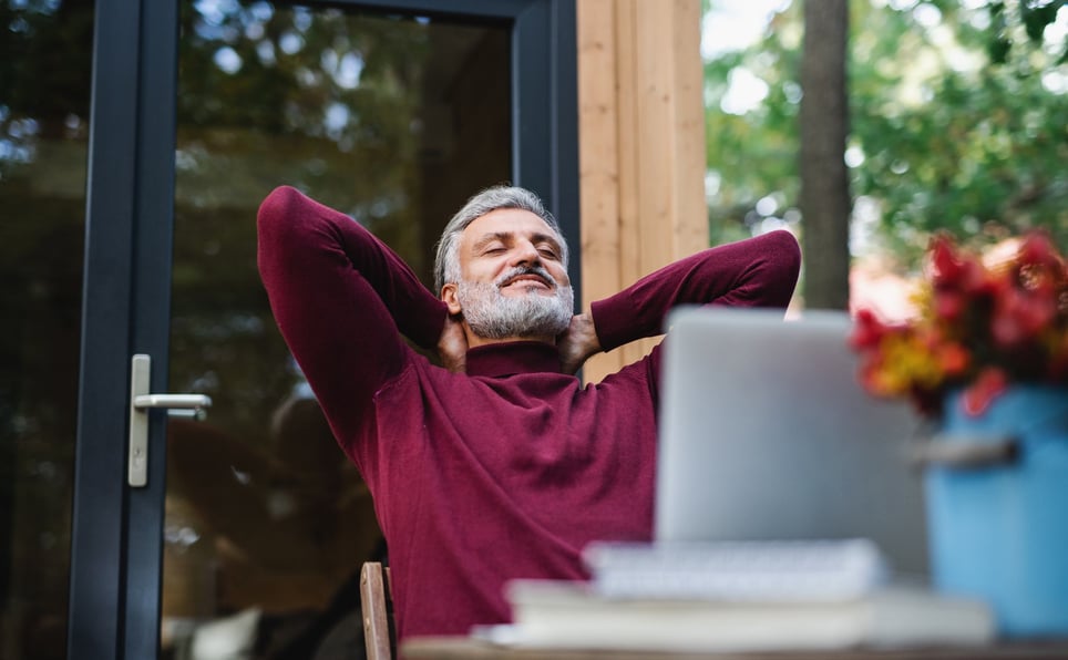 A-mature-man-outdoors-by-a-tree-house-meditating-how-to-focus-on-yourself
