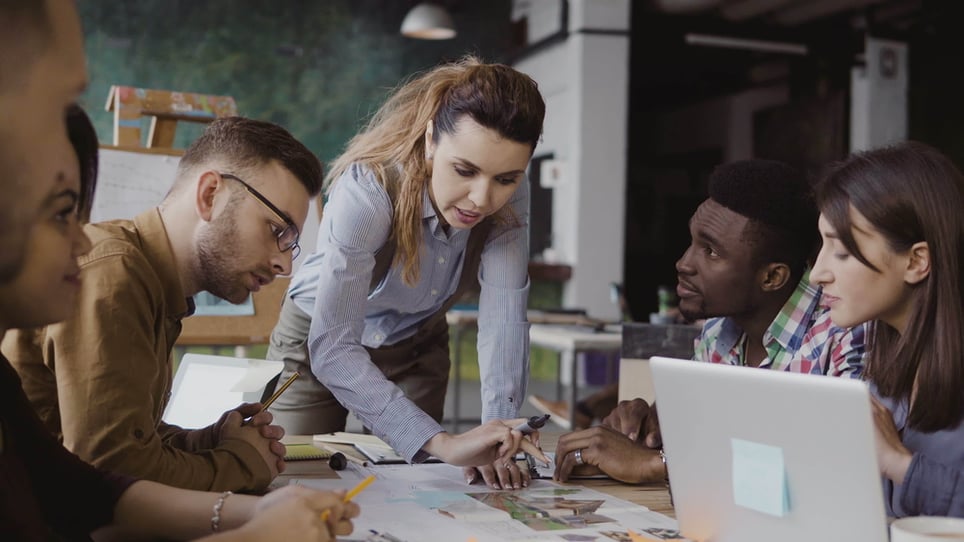 Brunette-female-team-leader-talking-benefits-of-leadership-training