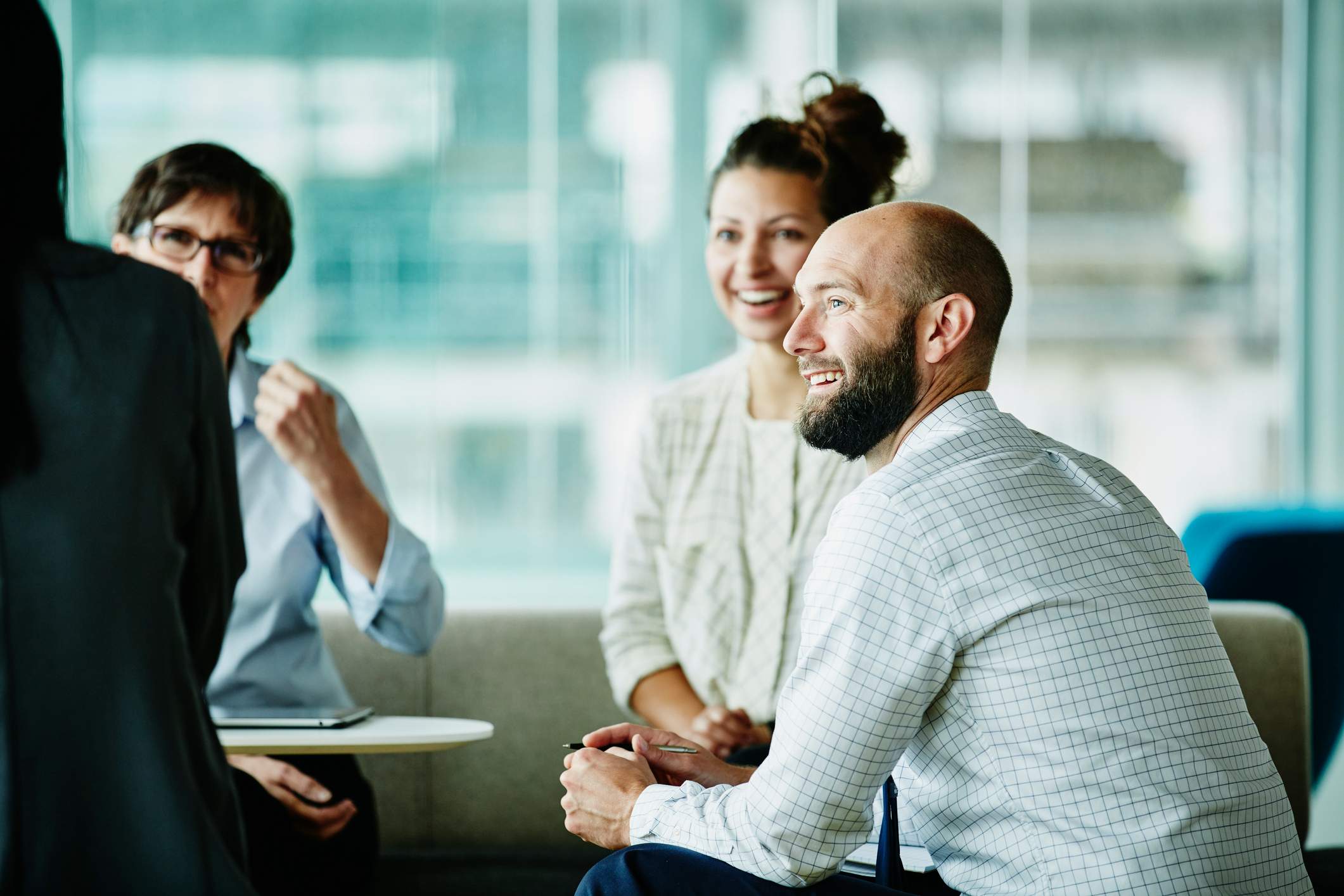 Businessman-in-discussion-with-colleagues-causes-of-workplace-stress