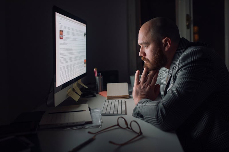 Businessman-working-late-from-home-toxic-work-environment