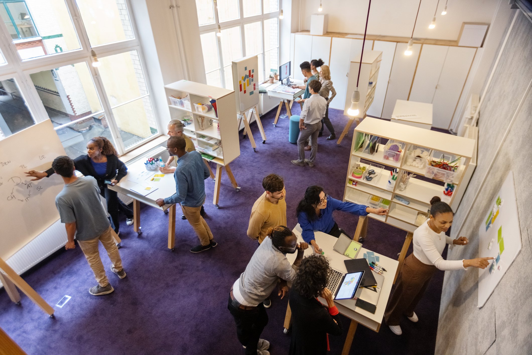 Coworkers-doing-team-building-activity-in-groups-at-office-workplace-environments