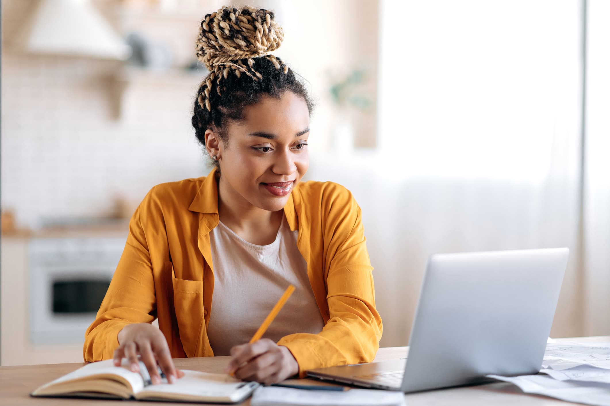 Focused-cute-african-american-female-studing-and-smiling-how-to-deal-with-rejection