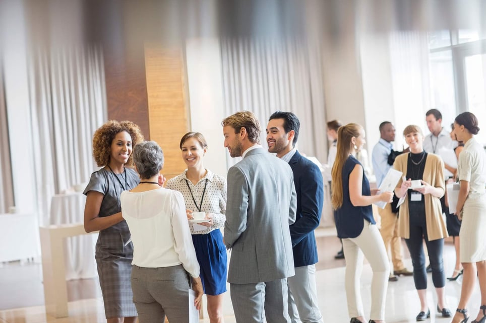 Group-of-business-people-standing-in-hall-building-a-network-from-scratch