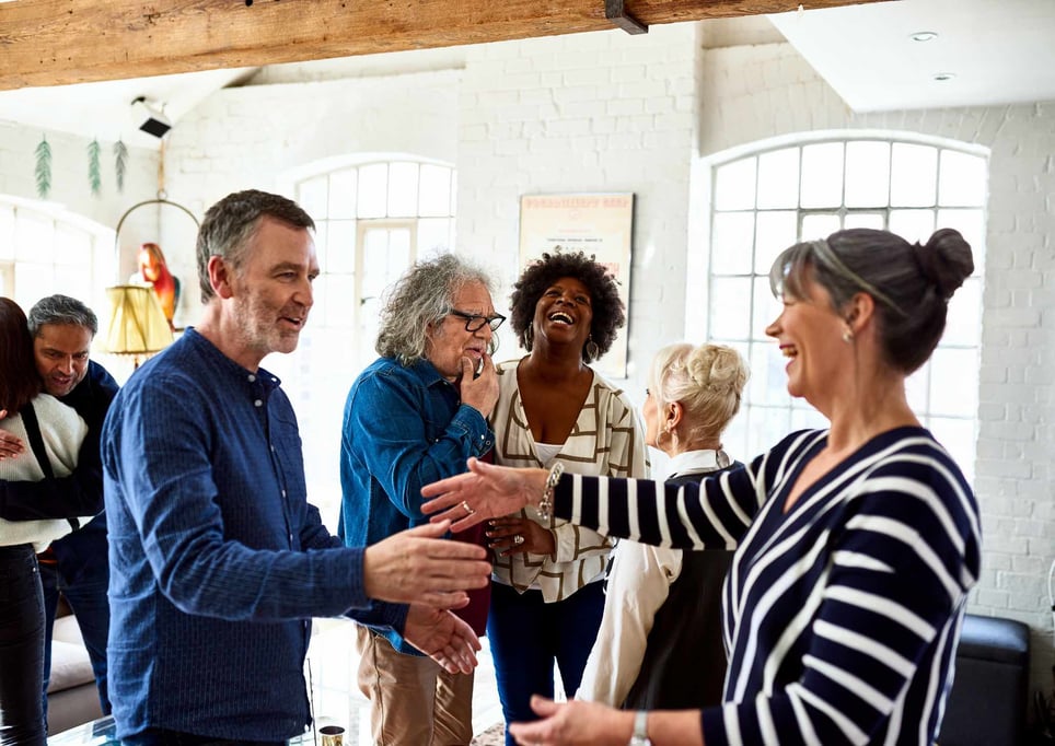 Group-of-diverse-people-happily-greeting-each-other-positive-personality-traits