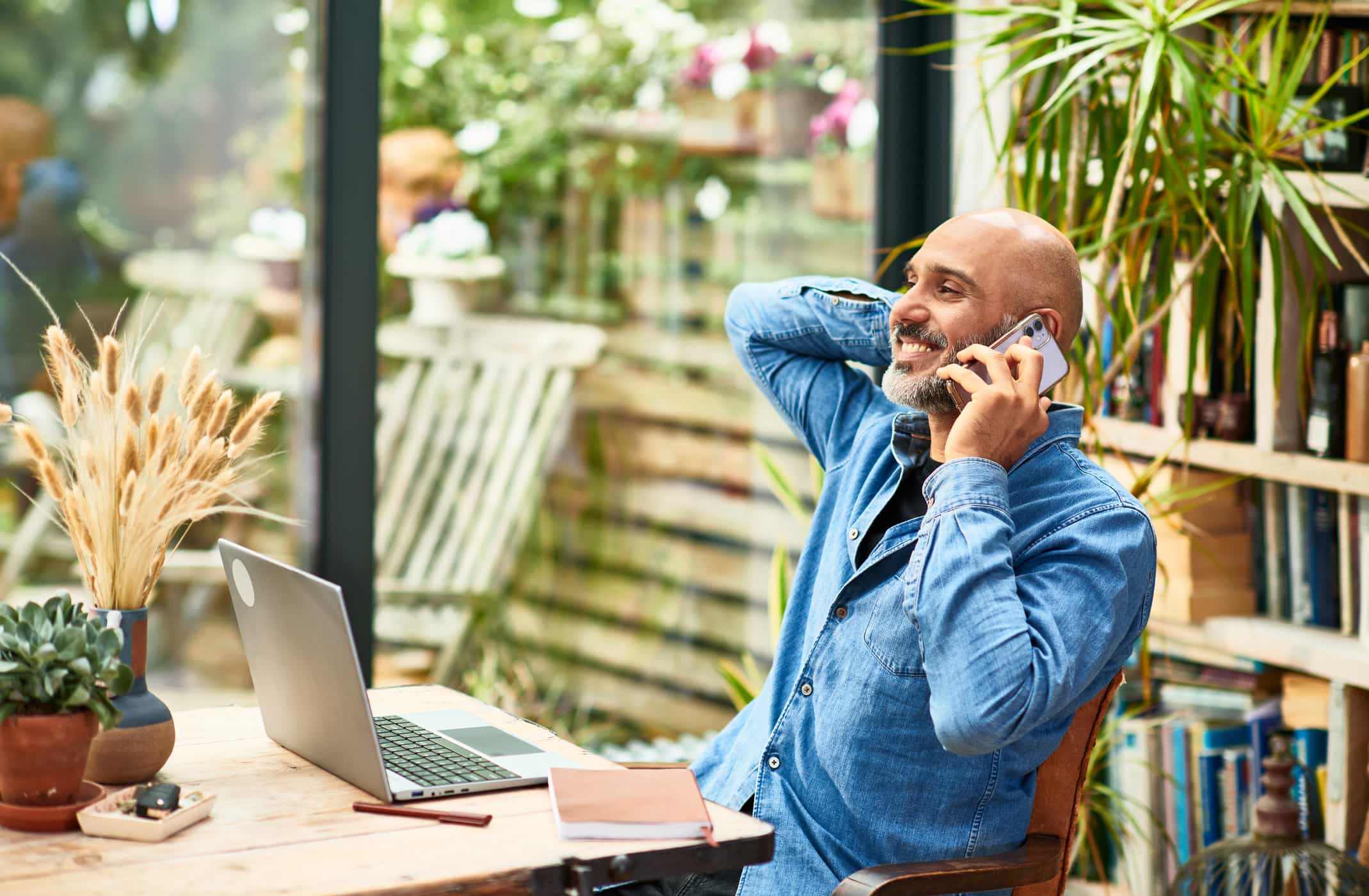 Happy-man-talking-with-past-employer-on-phone-what-do-employers-look-for-in-a-background-check