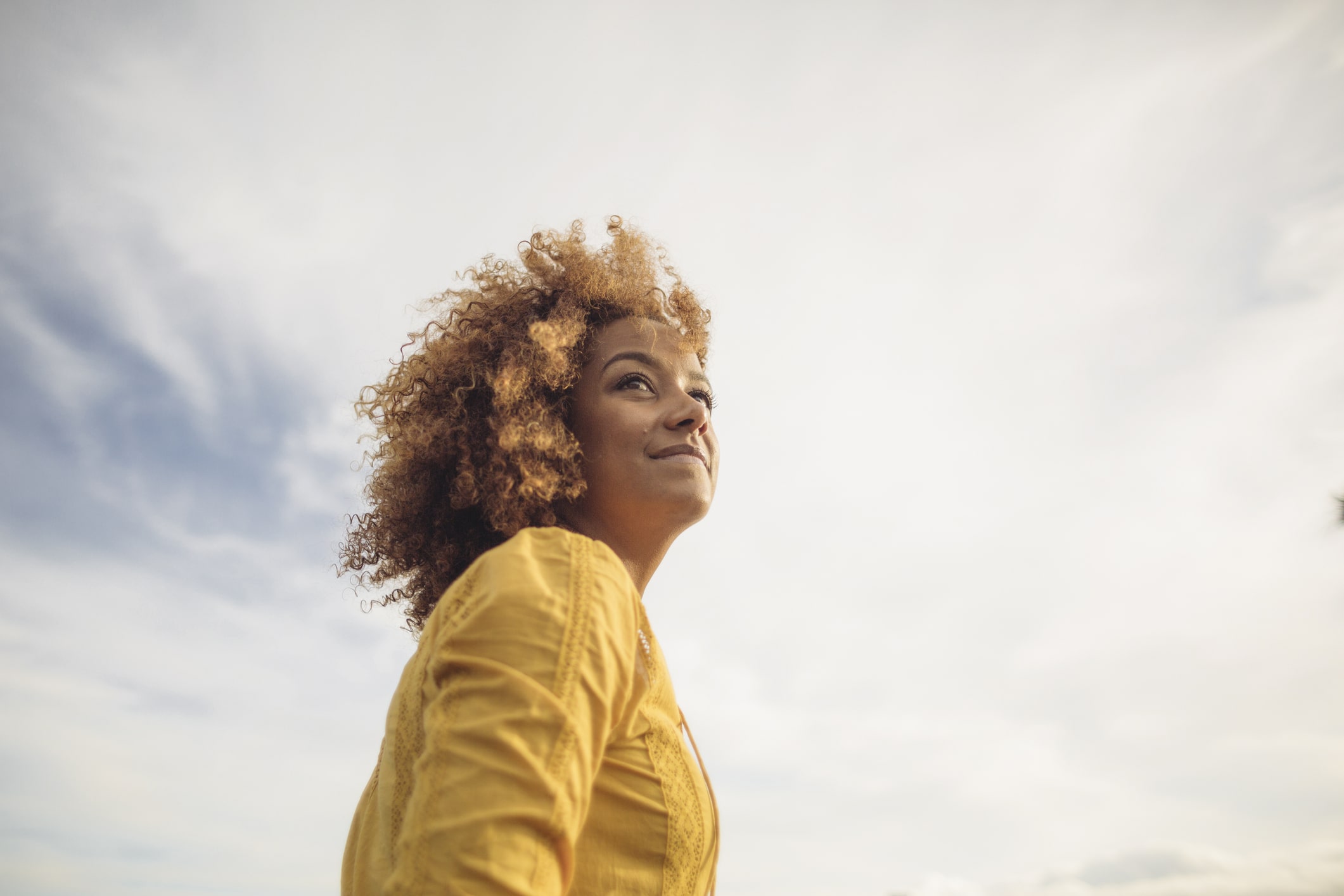 Low-Angle-Portrait-Of-Beautiful-Woman-Against-Sky-how-to-give-someone-space