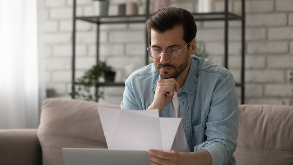 Male-holding-pice-of-paper-thinking-concentration-exercises