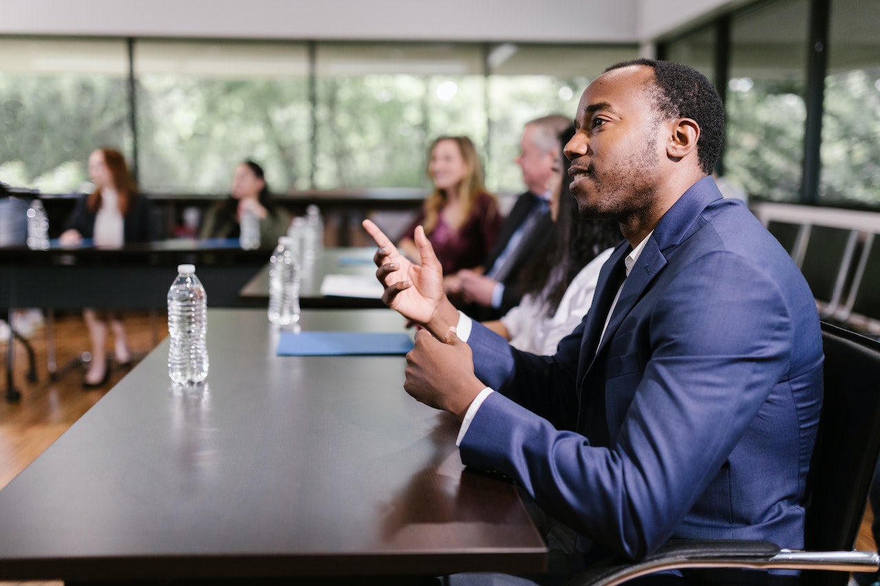 Man-listening-actively-at-meeting-negotiation-skills