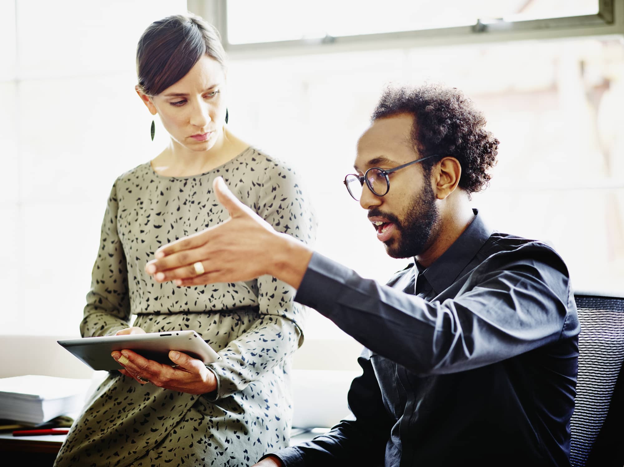 Man-reaching-out-to-his-boss-for-help-effects-of-peer-pressure