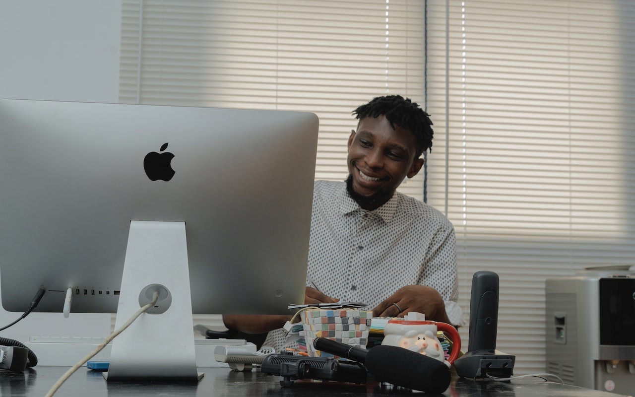 Man-setting-up-computer-at-his-house-life-skills-for-adults