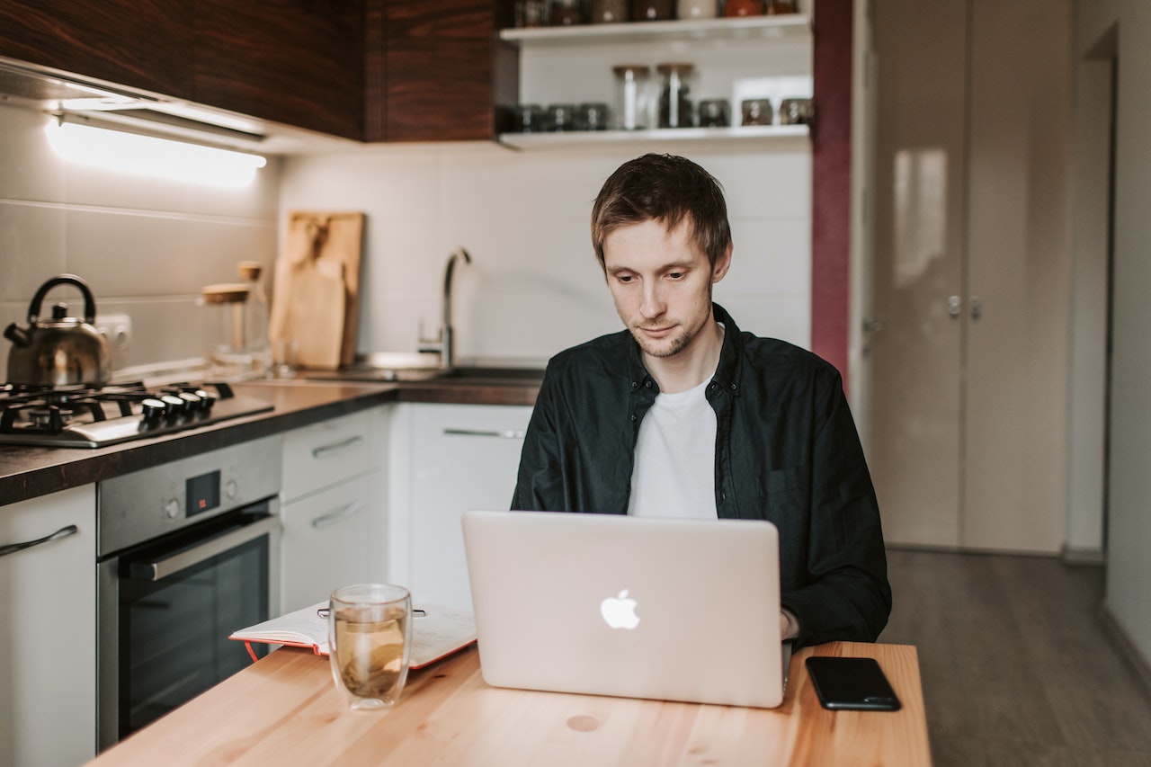 Man-using-laptop-from-home-negotiation-skills