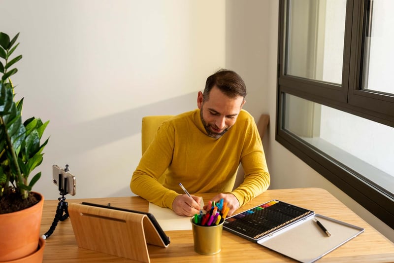 Man-writing-note-in-planner-how-to-find-happiness