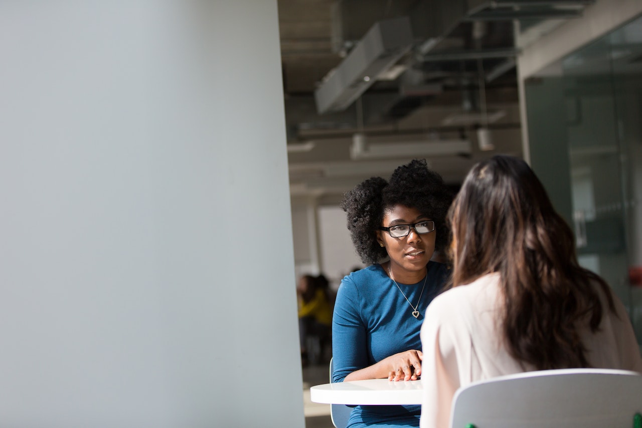 Manager-talking-to-her-peer-at-work-ethical-values