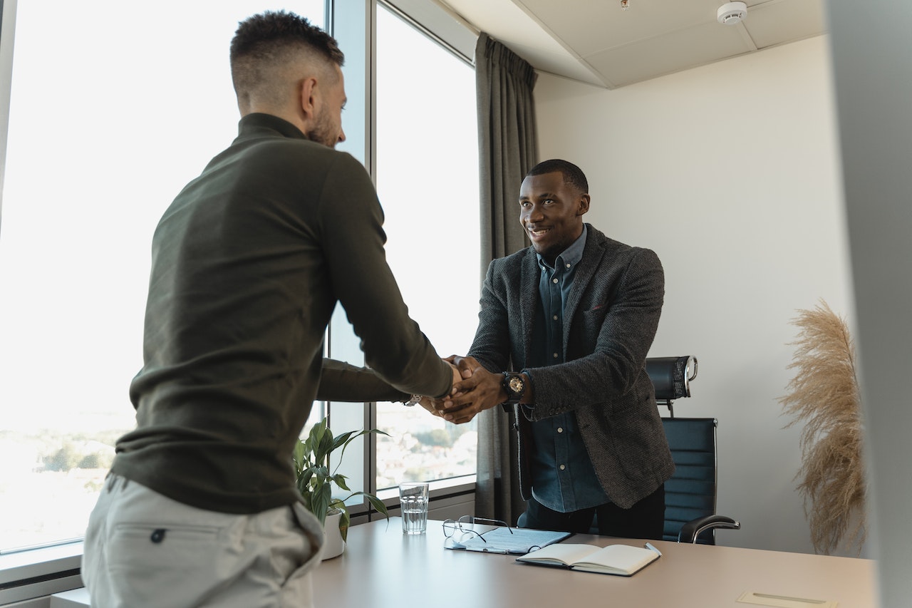 New-hire-smiling-and-shaking-hands-of-manager-at-office-7-38-55-rule