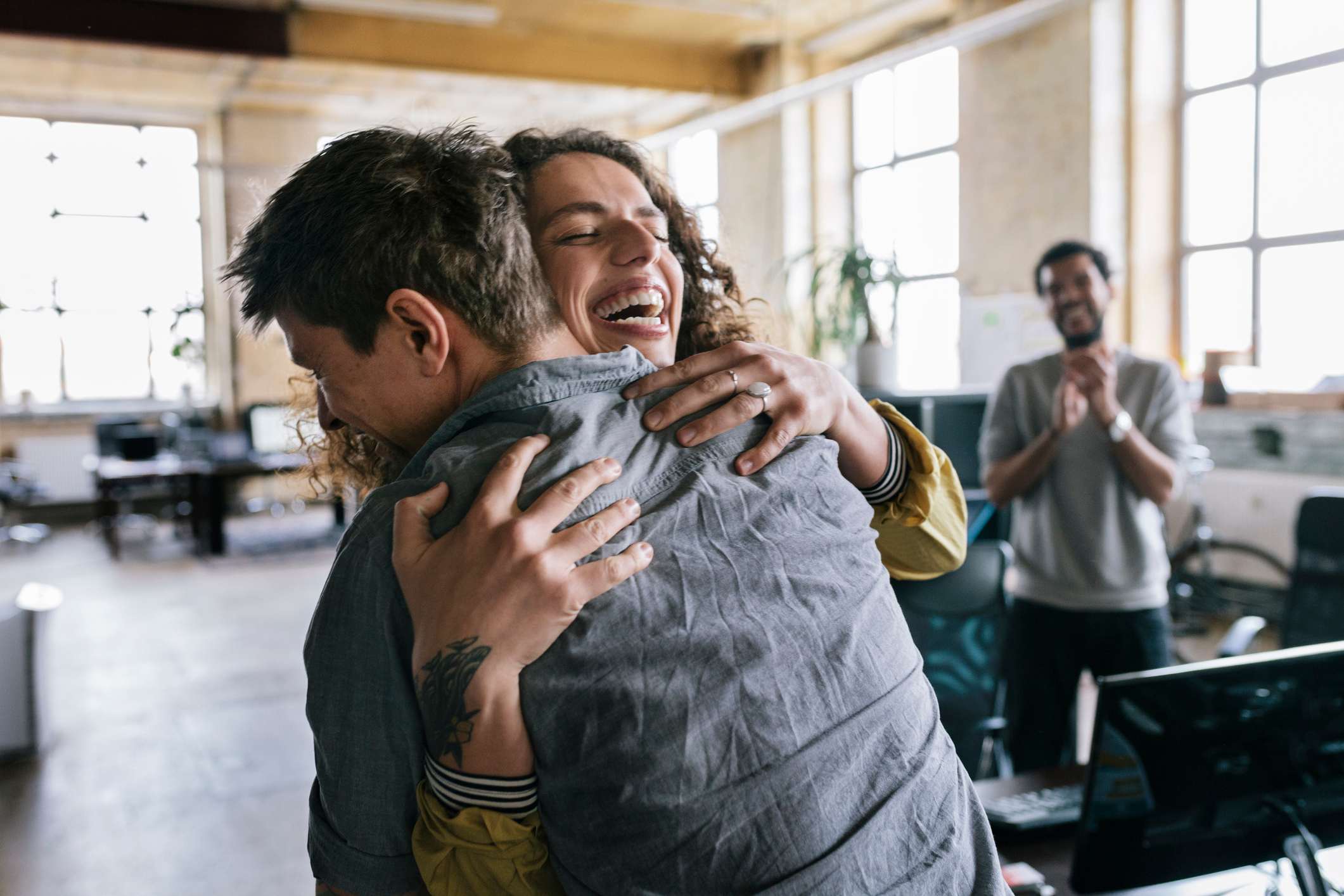 Office-workers-celebrating-together-goodbye-email-to-coworkers