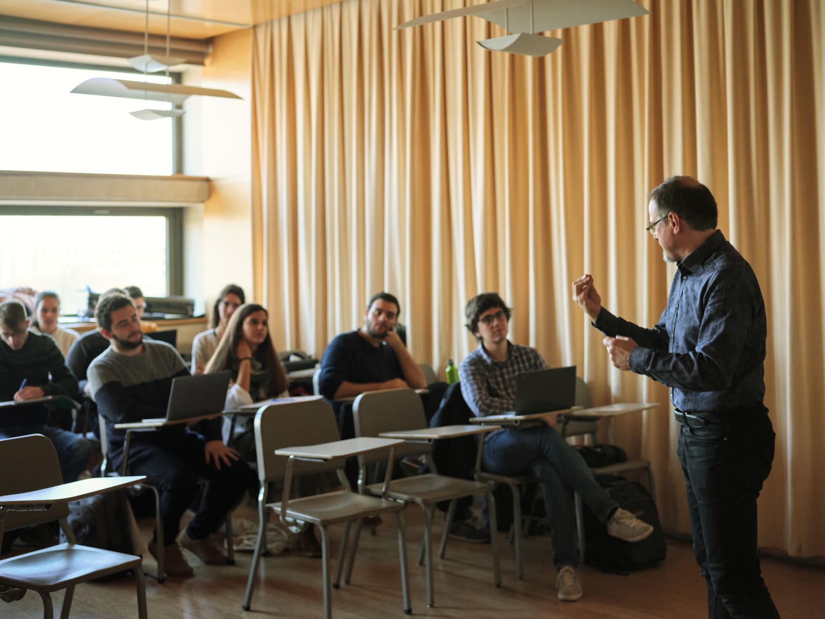 Professor-And-Students-At-The-Classroom-should-i-go-to-grad-school