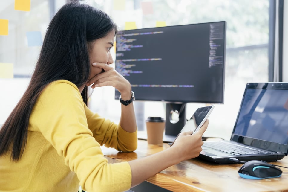 Serious-female-programmer-looking-at-computer-screen-how-to-hold-yourself-accountable