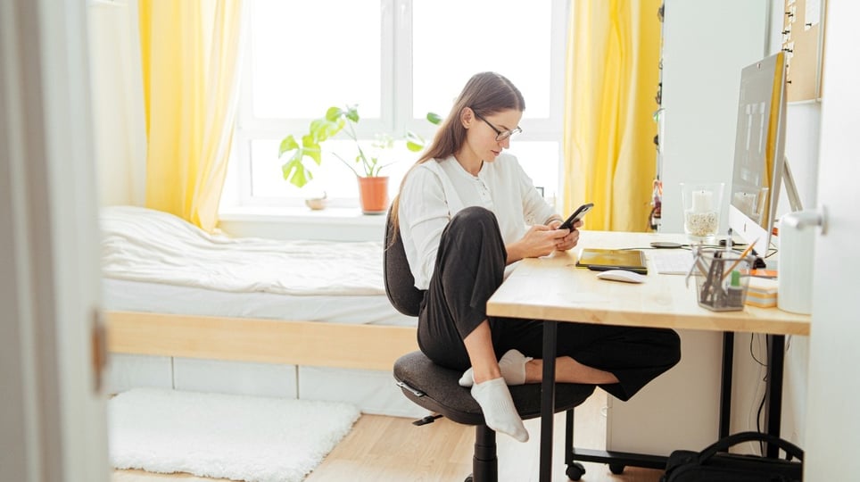 woman-scrolling-phone-in-bedroom-digital-detox