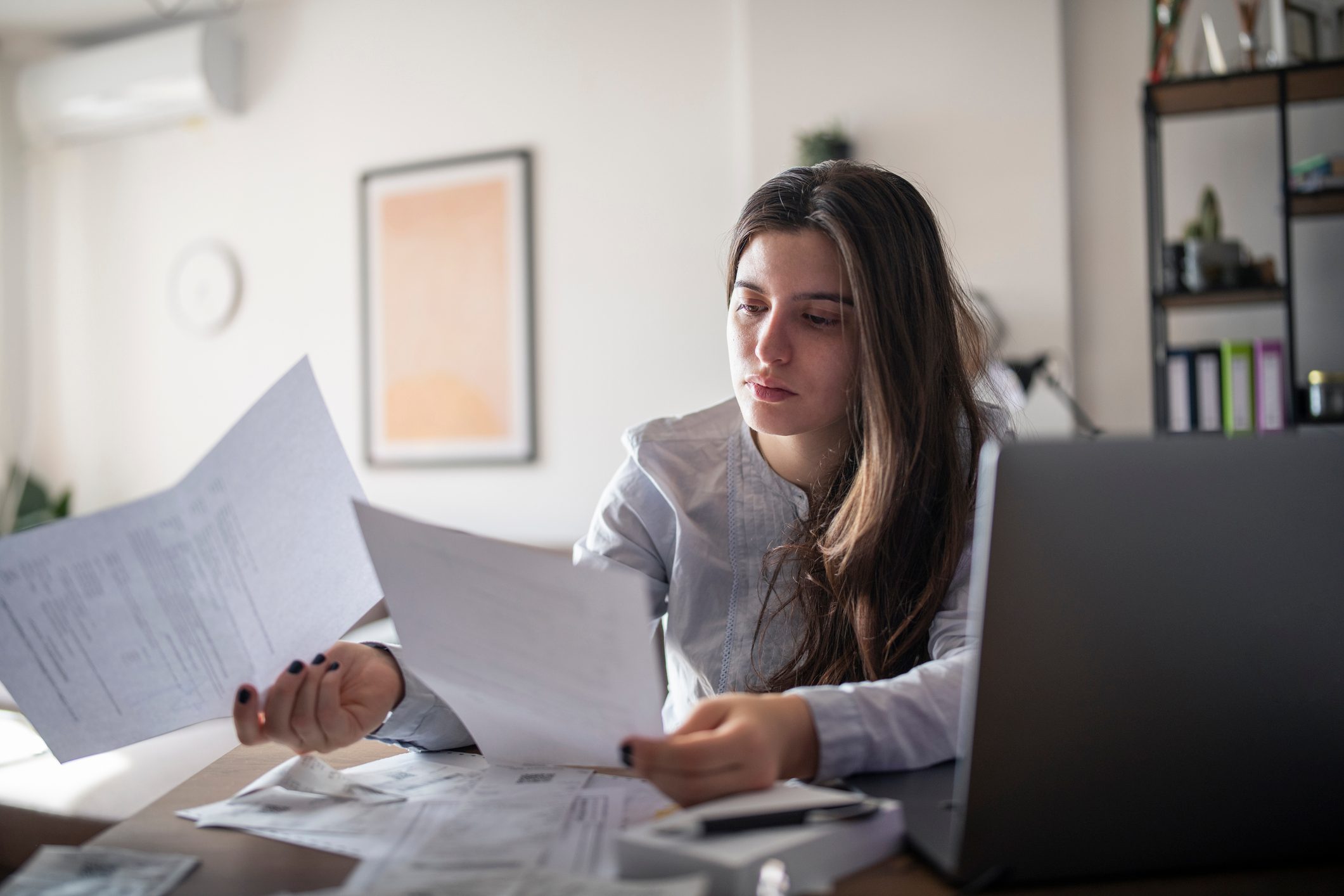 Stressed-woman-looking-at-bills-why-is-there-a-labor-shortage
