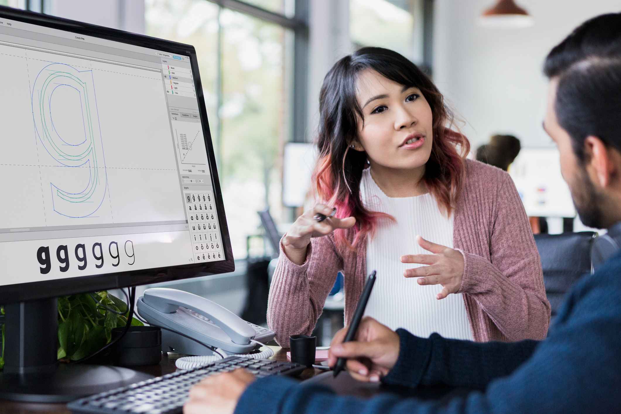 Two-design-professionals-discussing-project-at-office-what-is-gig-work