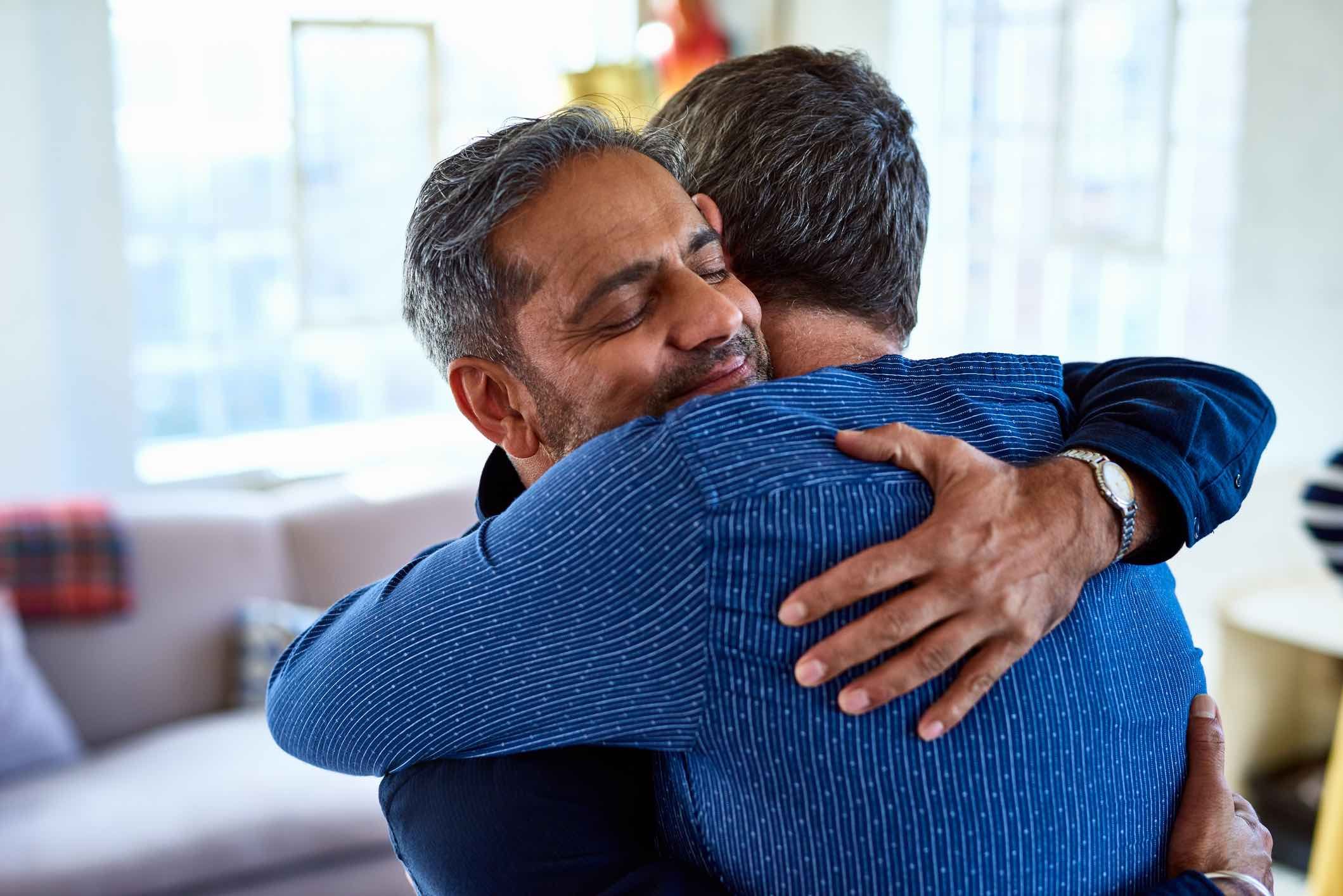 Two-happy-men-hugging-cognitive-empathy