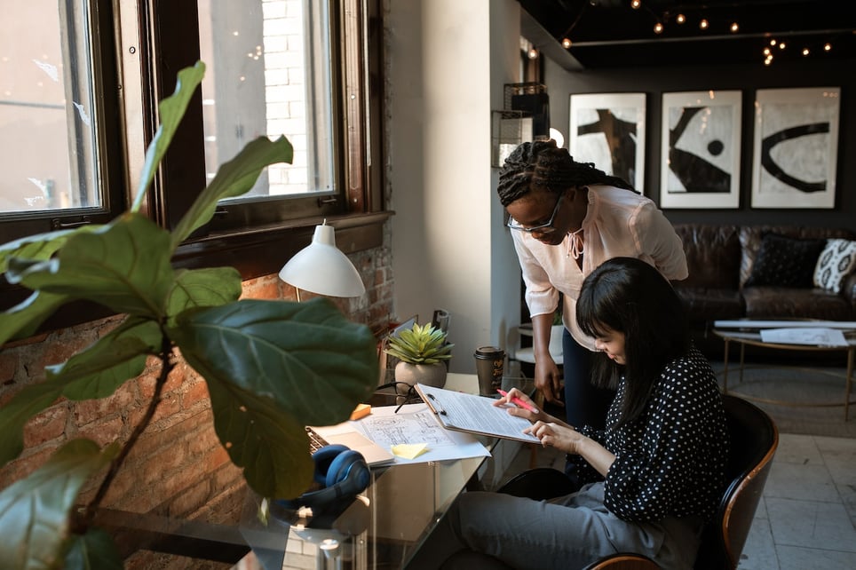 Two-women-reviewing-resume-together-at-office-resume-dos-and-donts