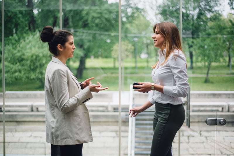 Woman-Talking-In-Hallway-how-to-connect-with-people