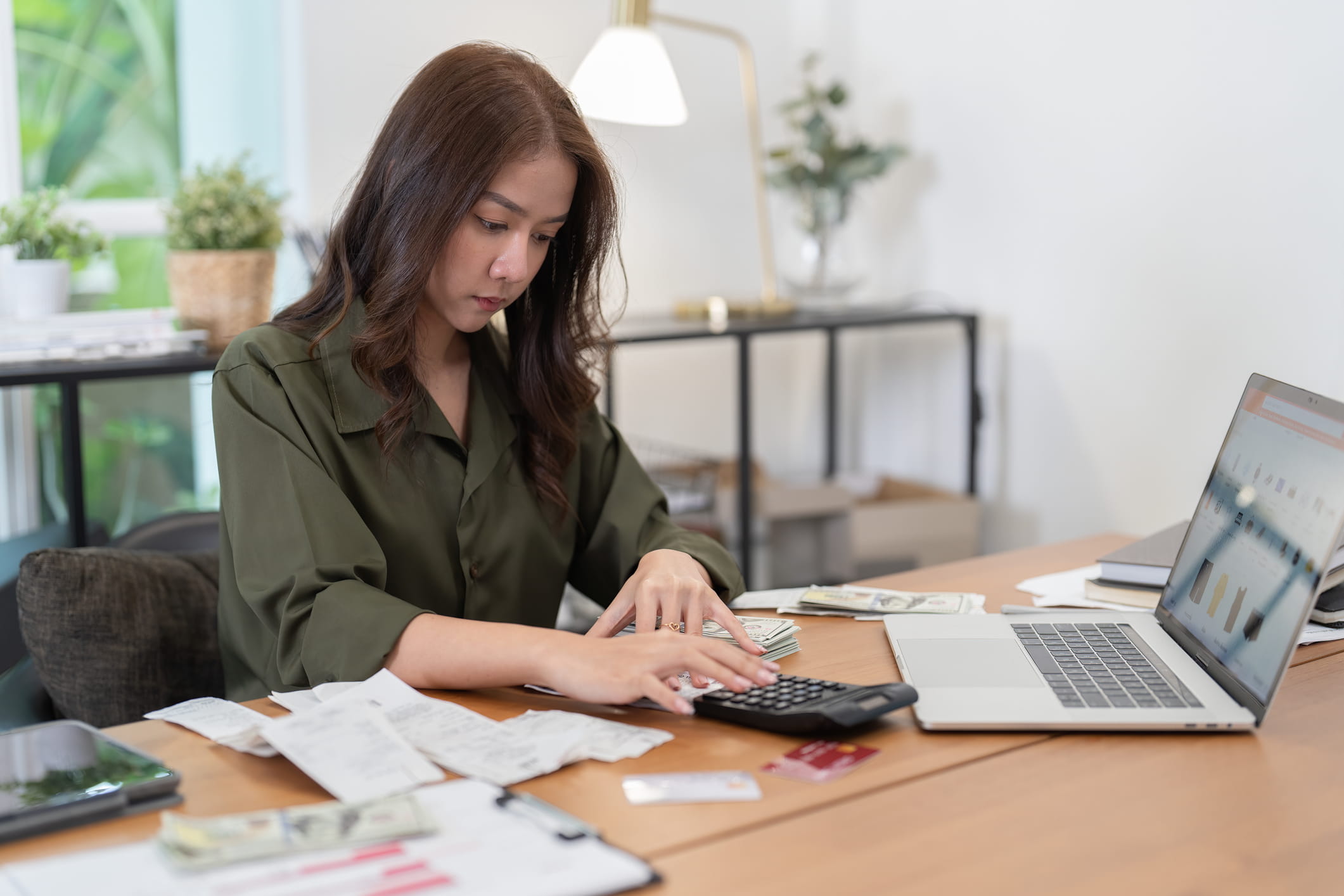 Woman-doing-financial-calculations-what-do-employers-look-for-in-a-background-check