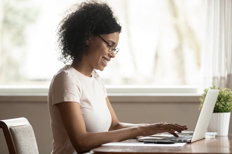 Woman-sending-email-from-her-laptop-personal-reason-leave