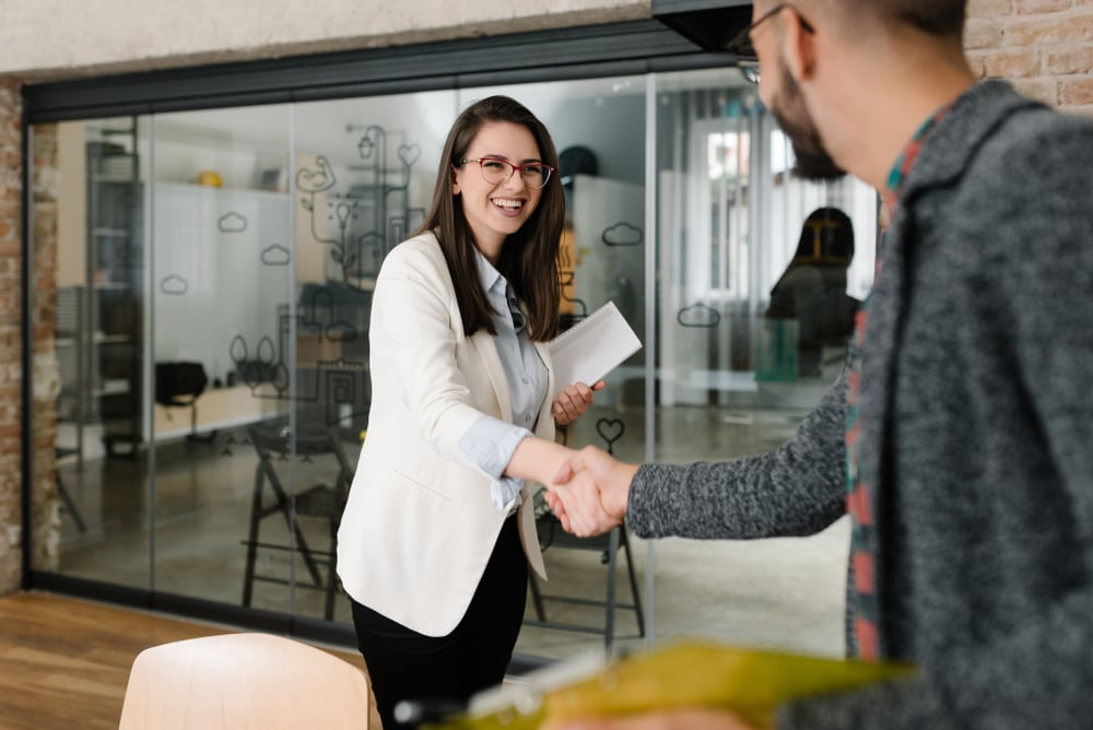 Woman-shaking-hands-with-aplpicant-linkedin-profile