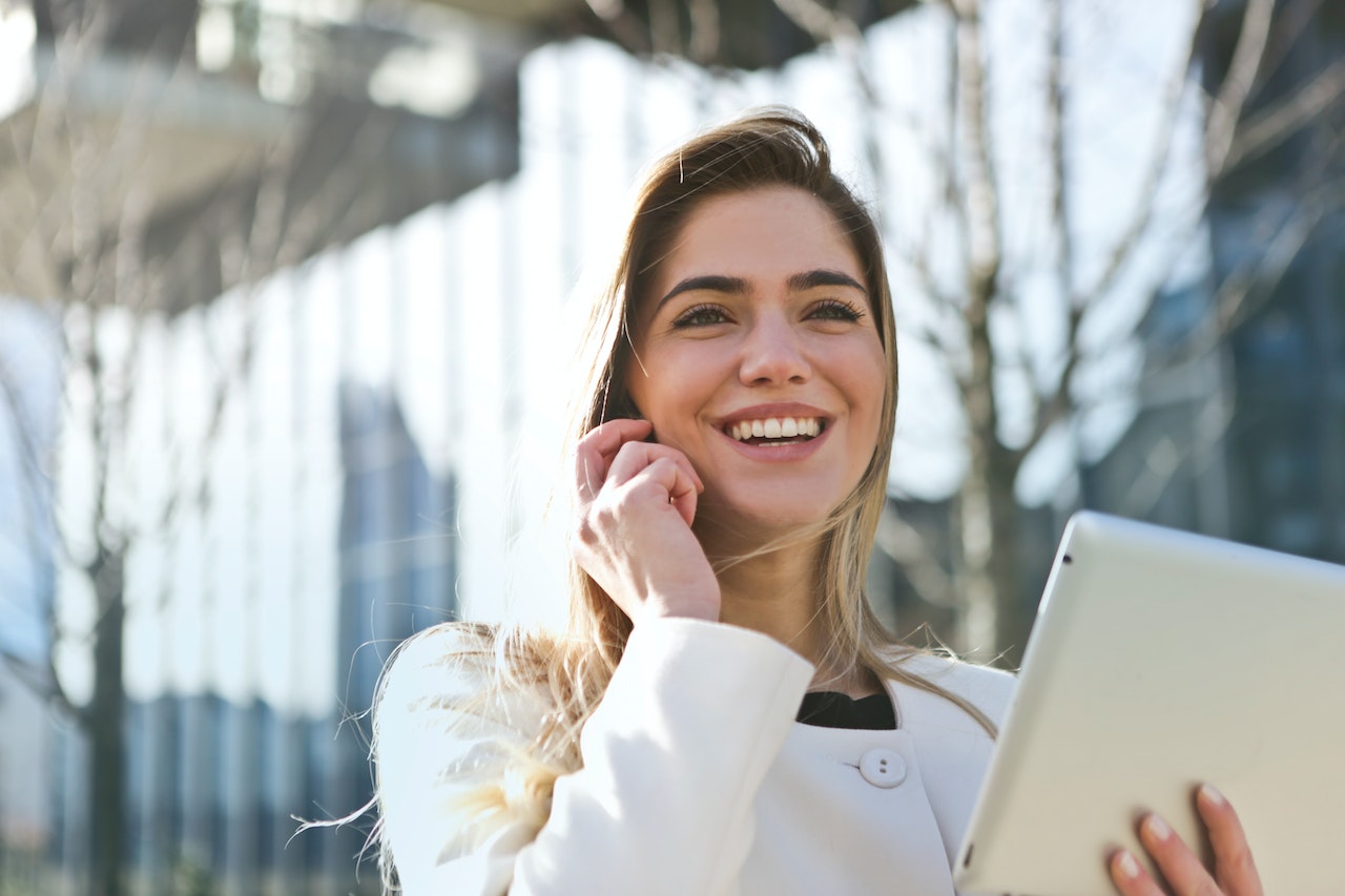 Woman-smiling-and-talking-on-the-phone-resignation-letter