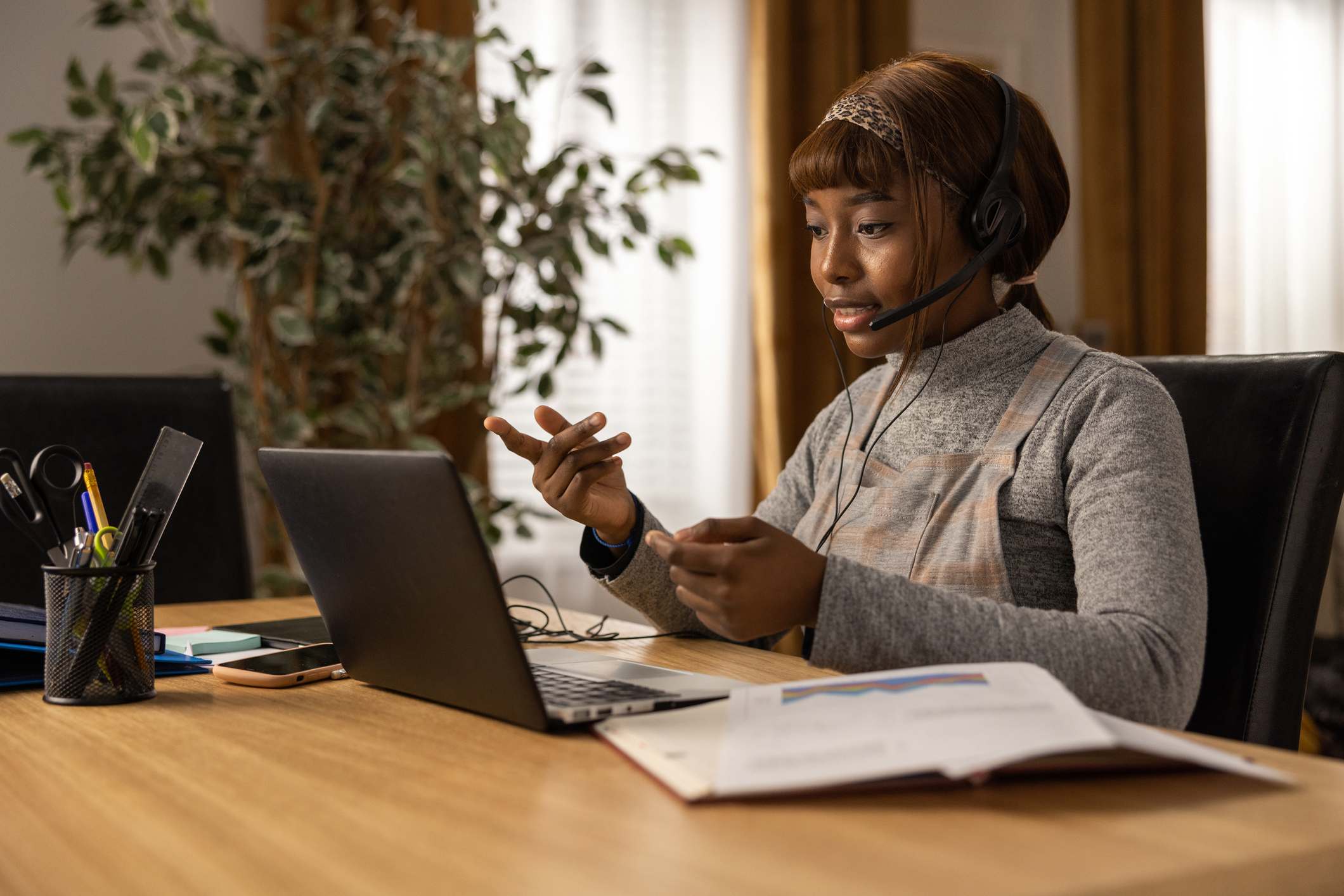 Woman-taking-online-classes-at-home-is-a-masters-degree-worth-it