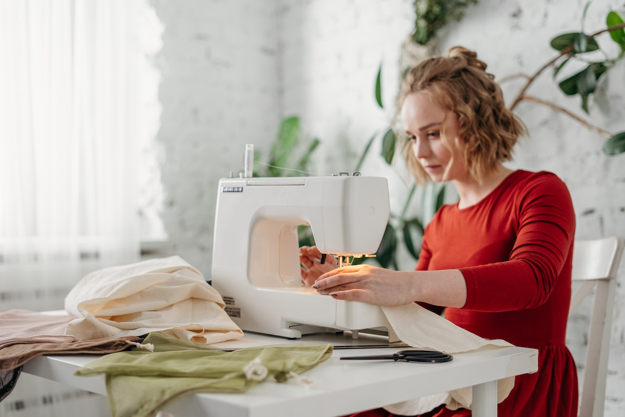Woman-using-sewing-machine-at-home-life-skills-for-adults