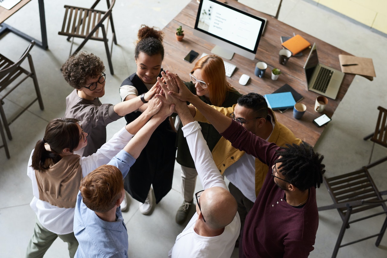 Work-team-giving-high-five-at-meeting-ethical-values
