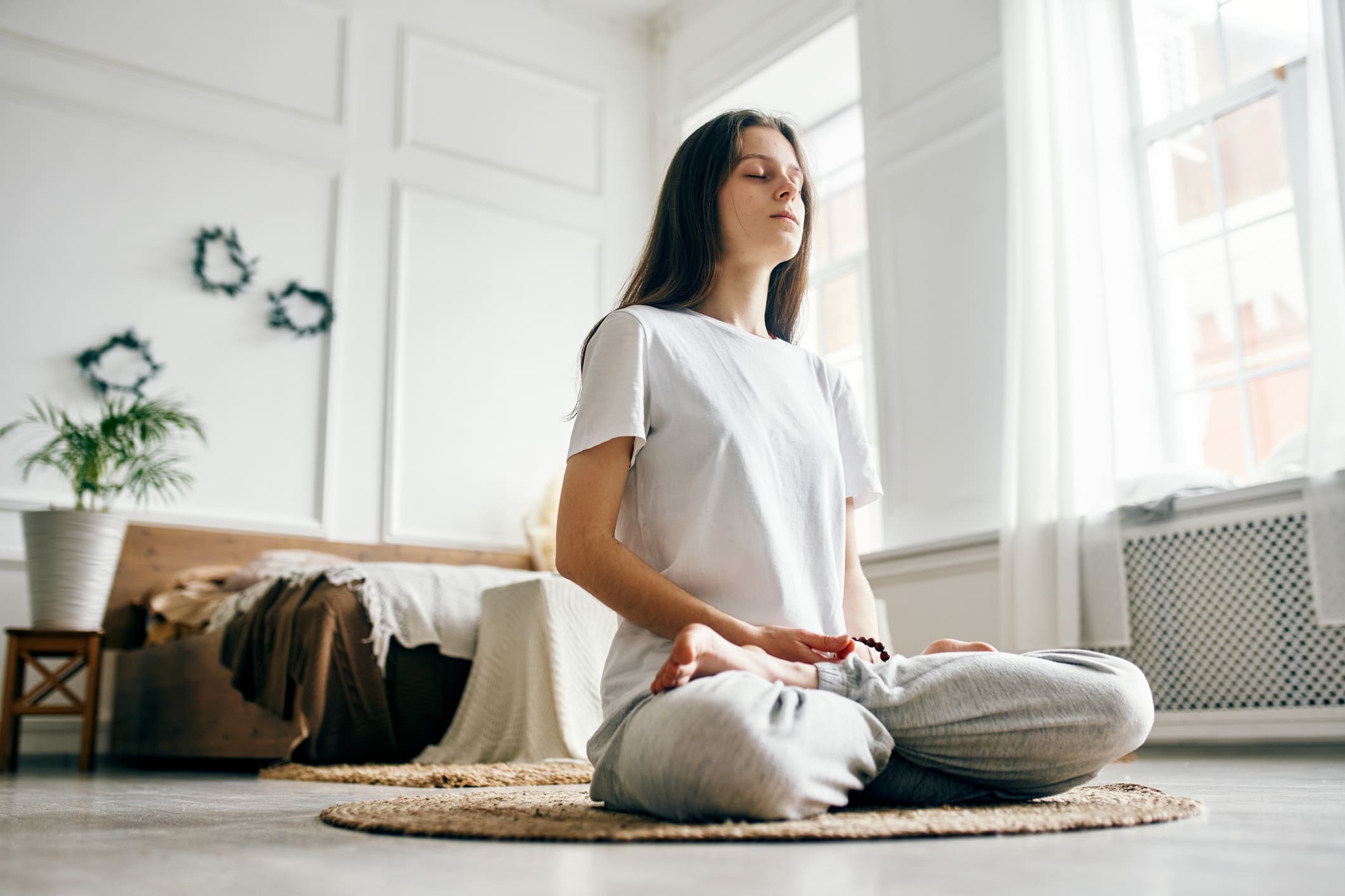 Young-beautiful-woman-meditating-self-reflection