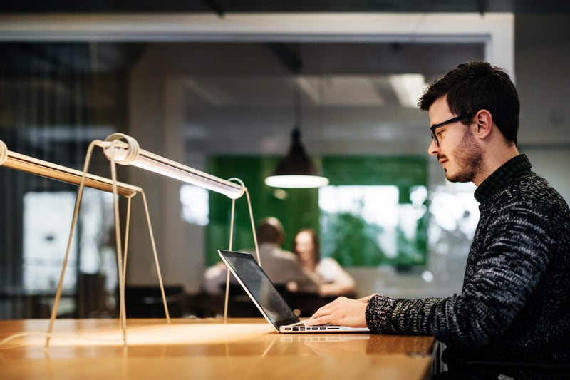 Young-businessman-working-late-in-his-office-best-job-posting-sites-for-employers-3