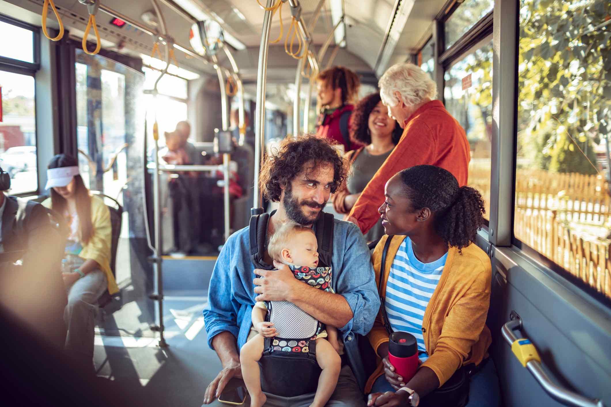 Young-couple-talking-in-public-transportation-positive-personality-traits