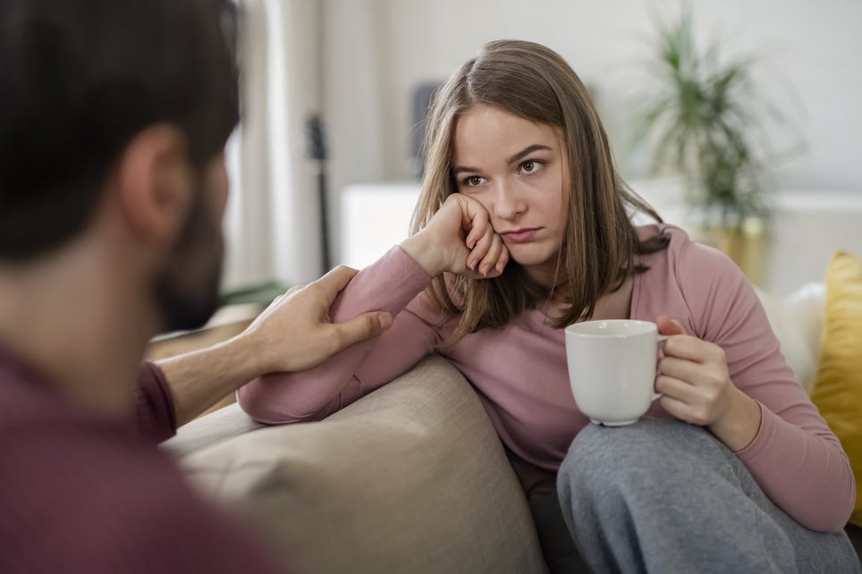 Young-woman-having-hard-conversation-with-offscreen-man-what-is-emotional-distress