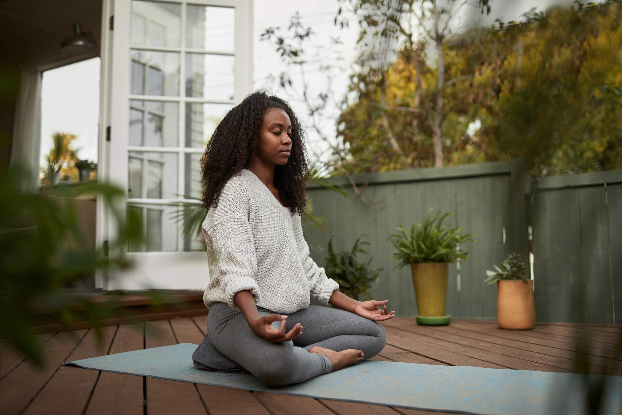 Young-woman-sitting-in-the-lotus-pose-mindfulness-vs-meditation