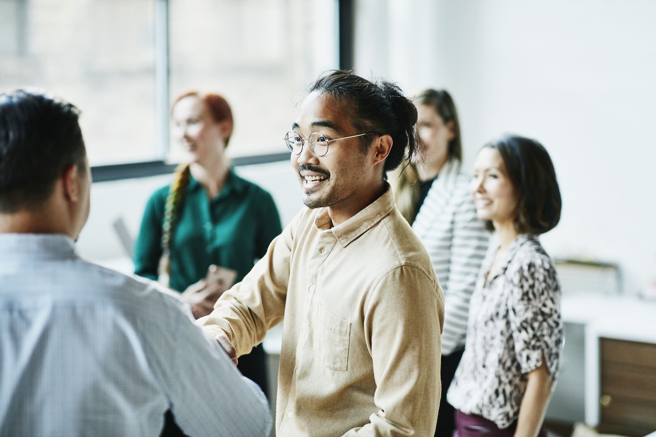 businessman-shaking-hands-with-colleague-how-to-build-a-team