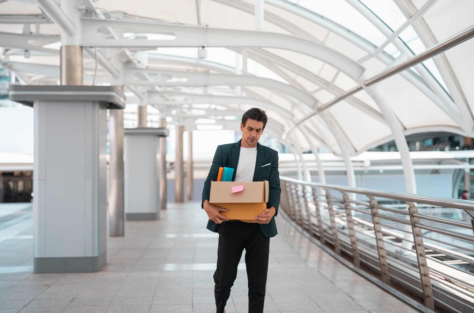 businessman-walking-after-being-dismissed-laid-off-from-work