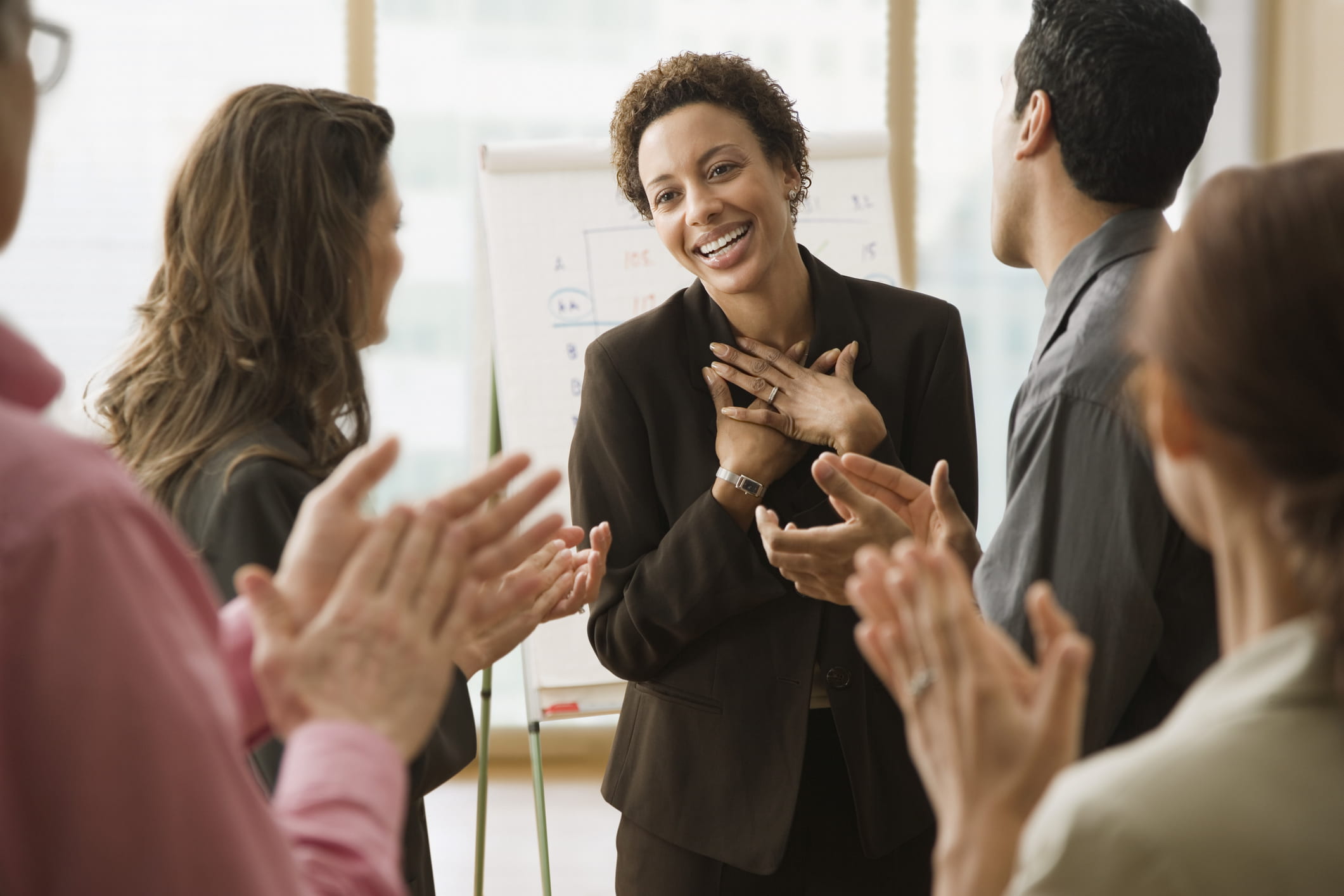 businesspeople-clapping-for-coworker-what-is-mindfulness