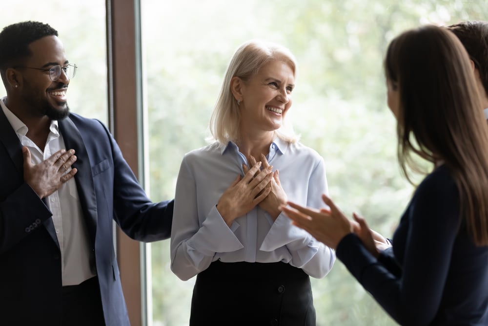 businesswoman-happy-at-work-with-coworkers-gratitude-at-work