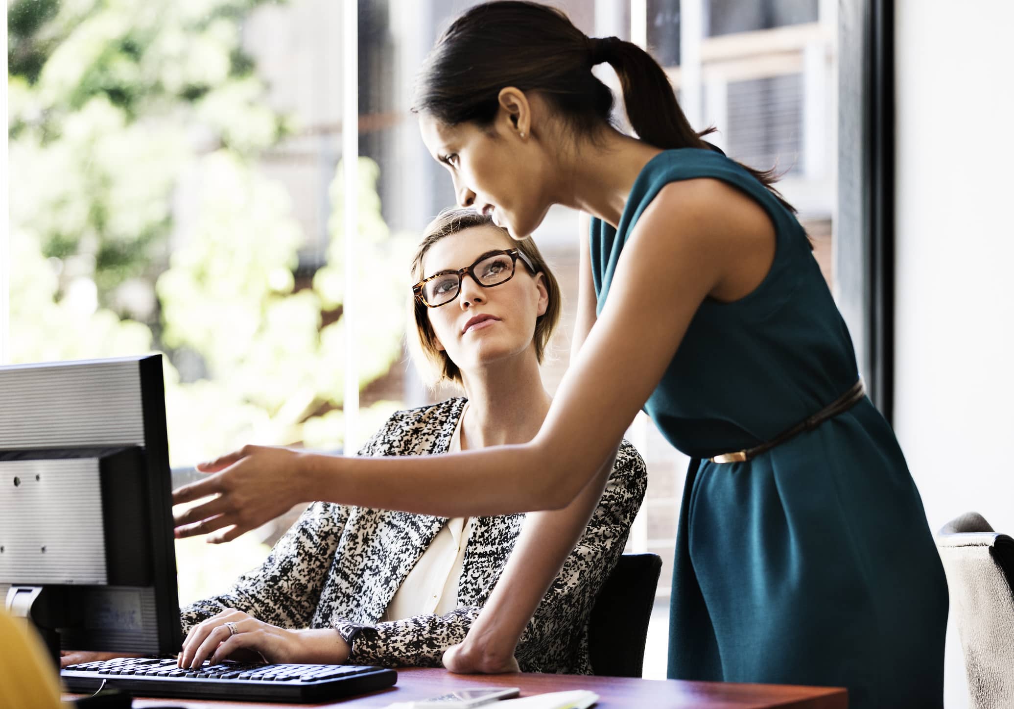 businesswoman-working-at-computer-what-are-adaptability-skills