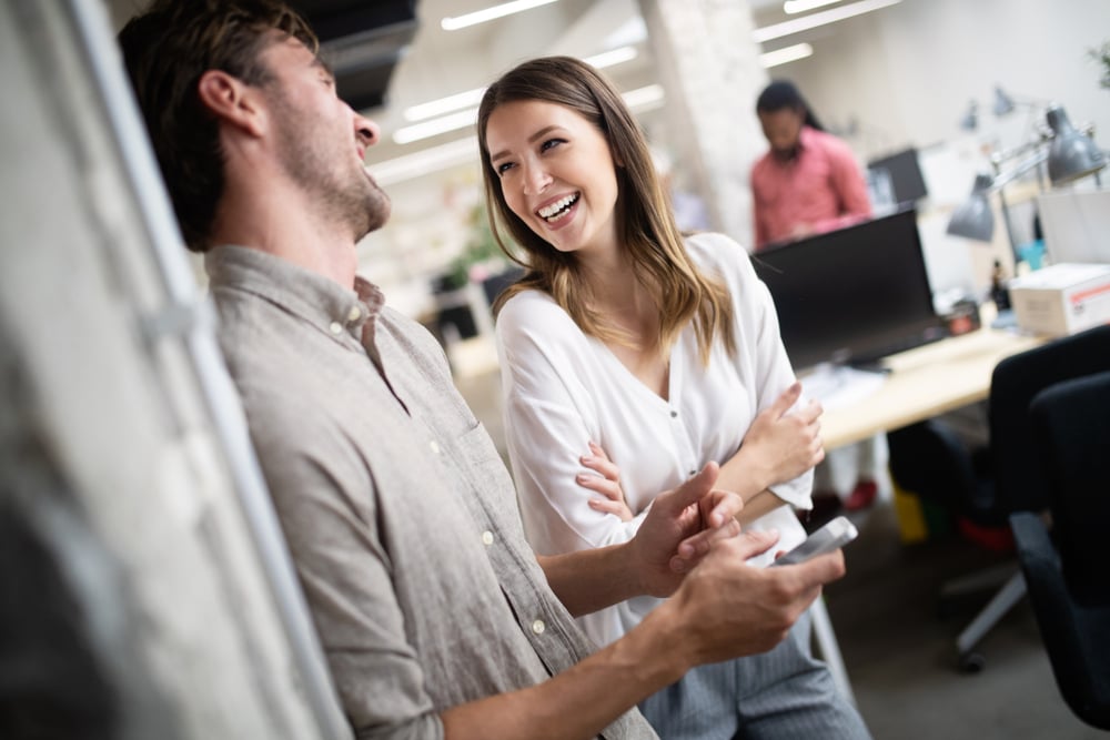 cheerful-coworkers-during-company-meeting-how-to-enjoy-life