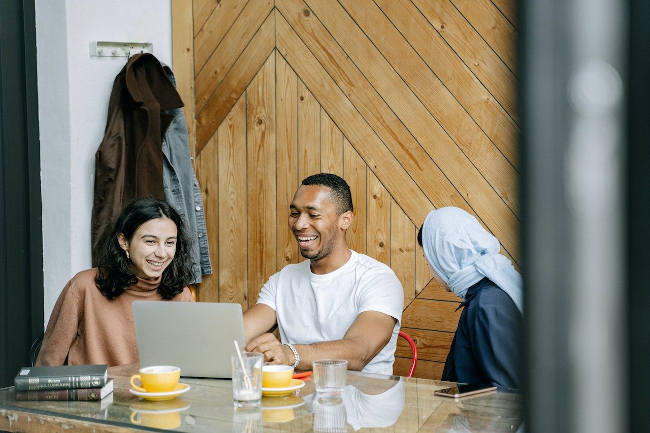 colleagues-at-meeting-smiling-and-talking-Thank-you-for-your-leadership-and-vision