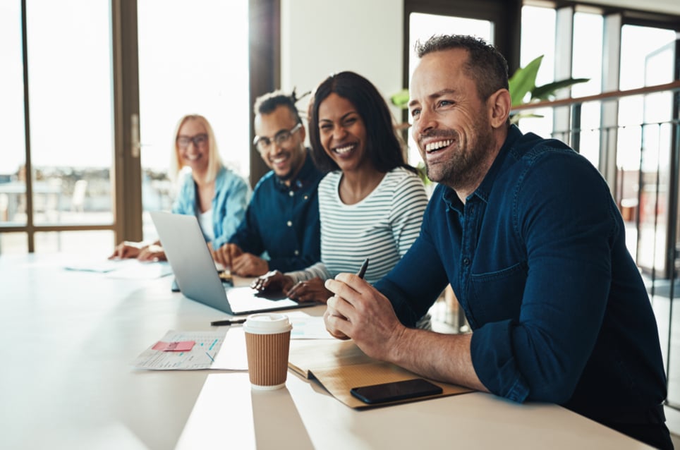 coworkers-laughing-in-the-office-types-of-work-relationships