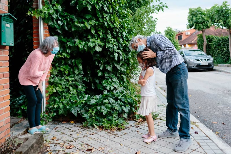 elder-couple-and-grandchild-distancing-1