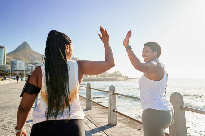 exercising-friends-high-fiving-how-to-feel-better-about-yourself