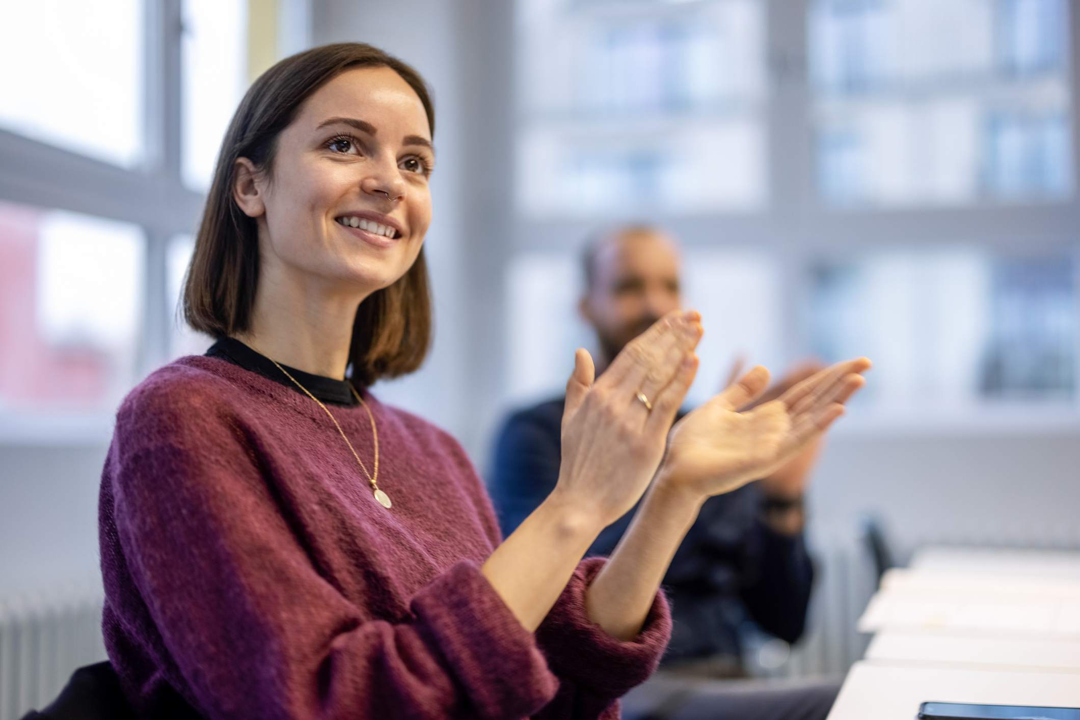 happy-business-team-applauding-after-a-succesful-presentation-interview-follow-up-email-after-2-weeks